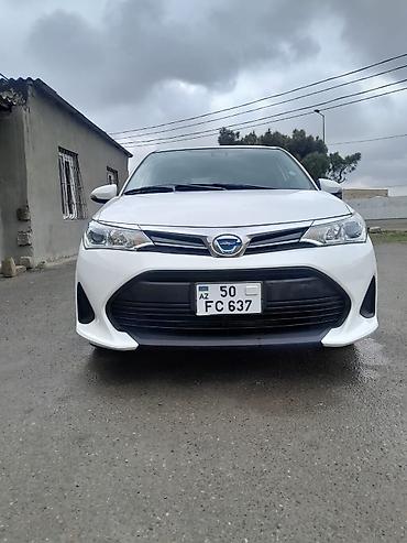 fielder: Toyota Corolla Fielder Hybrid – universal kuzovlu, ağ rəng. - Hibrid — 1