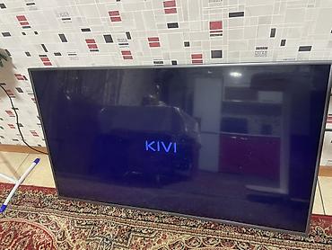 macbook 16: Телевизор KIVI, диагональ экрана около 55" (по габаритам корпуса) — 1