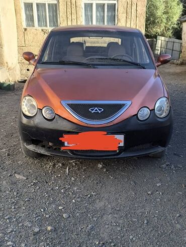 купить опель вектра б: Chery QQ6, компактный седан в ярком оранжевом цвете, выделяется своим