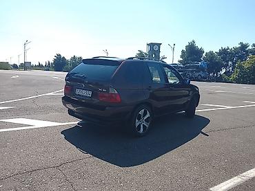 te 28 traktor satisi: BMW X5 (E53), bordoya çalan tünd qırmızı rəngdə SUV. Texniki və — 2