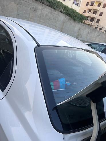 chevrolet cruze buferi: Chevrolet Aveo LS sedan, ağ rəngdə avtomobil. Şəkillərdən göründüyü — 10