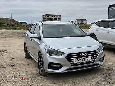 accent: Hyundai Accent sedan – gümüş rəng Əsas xüsusiyyətlər: - Kuzov: 4 — 1