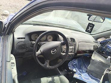Mazda 323: 2002 г., 1.6 л, Механика, Бензин, Хэтчбэк