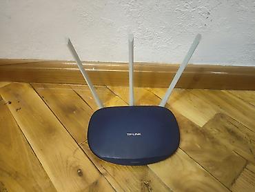 modem router tp link: Wi‑Fi роутер TP‑Link с тремя внешними антеннами. Основные — 1