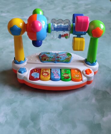 razvivajushhie igrushki dlja detej ot 3 let: Детская игрушка с музыкой, верхние игрушки крутятся. Работает от 3