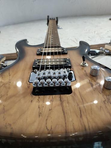 gitara akustik: Elektro-gitara Model:Smiger L-G8 Simlərin sayı: 6 Üst:Deadwood — 3