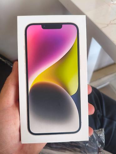 IPhone 14, цвет Starlight (светлый). В комплекте фирменная коробка