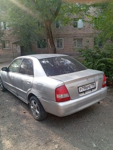 мазда цена: Седан Mazda Familia серебристый цвет. объем 1.5. 2000год СТС .ПТС ы