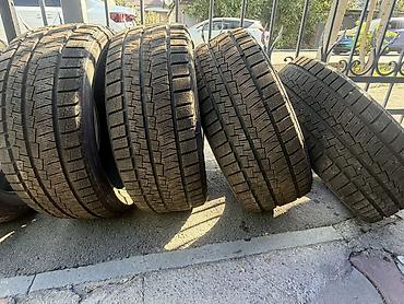 Шины: Комплект зимних шин 235/50 R18. Новые На фото — 4 автомобильные шины — 1