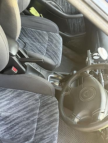 амартизаторы: Subaru Legacy: 1997 г., 2.5 л, Автомат, Бензин, Универсал — 5