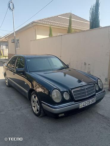 Mercedes-Benz: Mercedes-Benz E-Class: 2.3 l | 1995 il Sedan — 2