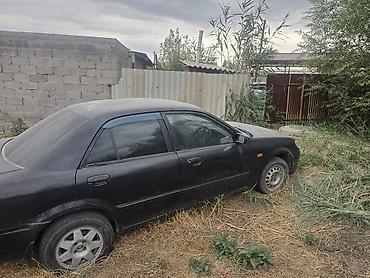 мазда фамили: Mazda Familia: 2003 г., Автомат, Седан — 6