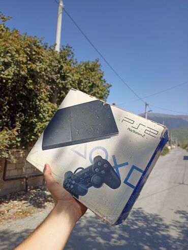 mini qabyuyan maşın: Sony PlayStation 2 Heç bir problemi yoxdur.Yanlız orginal disklər açır