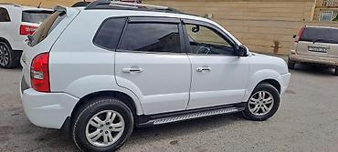 suzuki grand vitara: Hyundai Tucson: 2 l | 2006 il Ofrouder/SUV — 3
