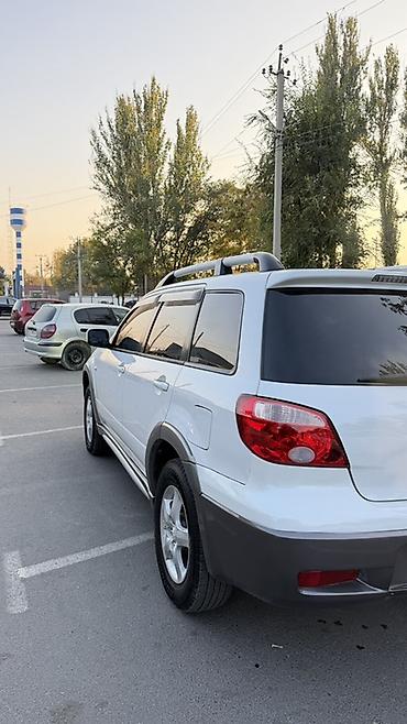 фары на митсубиси: Mitsubishi Airtrek: 2004 г., 2.4 л, Автомат, Газ, Кроссовер — 3