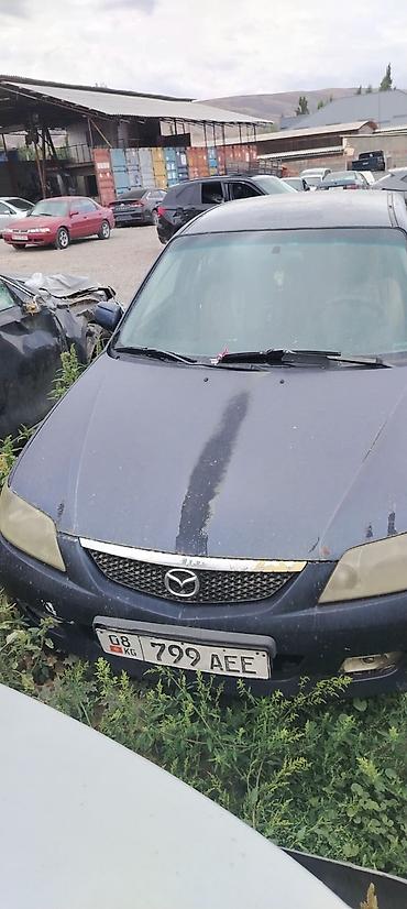 кажы сай: Mazda 323: 2001 г., 1.6 л, Кол менен иштөөчү, Бензин, Универсал — 9