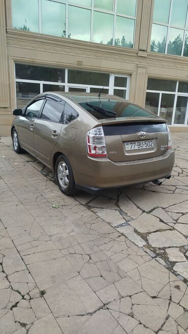 Toyota: Toyota Prius (II nəsil) hibrid liftbek - Rəng: qızılı/boz (bej ton) - — 2