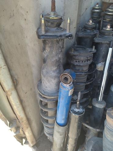 Амортизаторы, пневмобаллоны: Амортизатор передний задний Мазда Демио комплект Рф3 задний св6 задний — 5