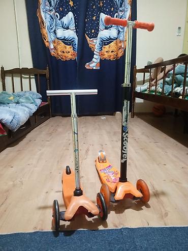 2 tekerli scooter: Uşaq skuterləri – 3 təkərli, narıncı rəng - İki ədəd skuter: biri — 1