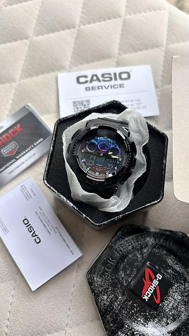 g shock: Casio G-Shock qol saatı. Qara rəngli, iri korpuslu və idman üslublu — 1