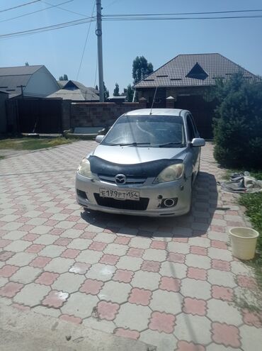 машиналар: Представлен автомобиль Mazda Demio, 2005 года выпуска, в серебристом