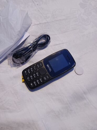 Ostali mobilni telefoni: MKTEL 106 – klasični mobilni telefon Glavne karakteristike: - Ekran — 7