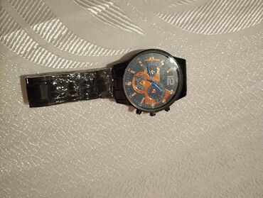 prada eynekleri qiymeti: Klassik üslubda kişi qol saatı - Qara rəngli metal korpus, dairəvi