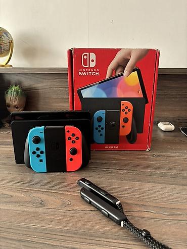 nintendo switch cip: Nintendo Switch OLED (Neon Blue/Neon Red) oyun konsolu - 7.0 düym — 1