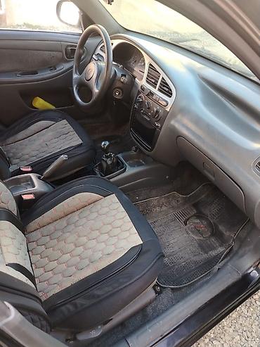 Daewoo: Daewoo Nexia: 1.3 l | 2010 il Sedan — 6