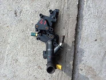 mk 2010: KUCISTE TERMOSTATA ZA PEUGEOT 206, 207 | Originalni polovni delovi — 1