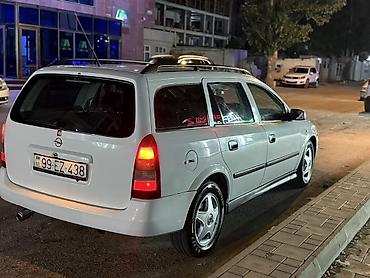 opel astra maşın: Opel Astra Caravan (ağ), universal kuzov - Geniş yük və sərnişin — 10
