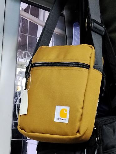 барсетки кархарт: Сумка через плечо Carhartt, цвет горчичный - Компактная городская — 1