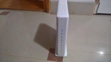 Modemi, ruteri i mrežni uređaji: Various used modems and routers from brands like Sagemcom, ZTE — 1