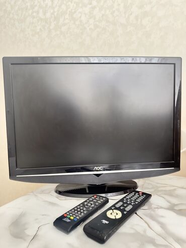 dvb: Телевизор LOC с плоским экраном и черным корпусом.В комплекте с