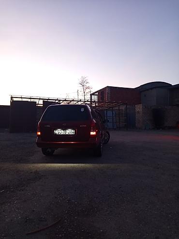 tap az opel vectra: Opel Astra универсал kuzovlu minik avtomobil. Rəngi tünd qırmızı — 4