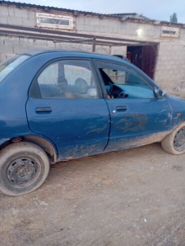Mazda: Mazda 121: 1991 г., 1.3 л, Механика, Бензин, Седан