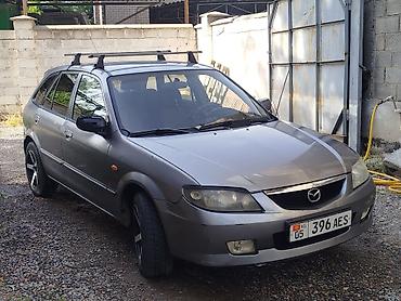 мазда унивесал: Mazda 323: 2002 г., Механика, Бензин, Универсал — 1