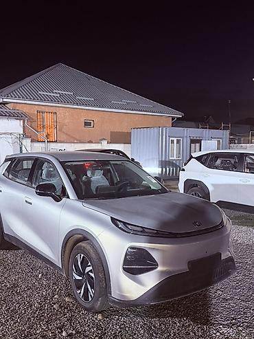 Электр транспорту: Электромобиль кроссовер, серебристый кузов Основные особенности: - — 2