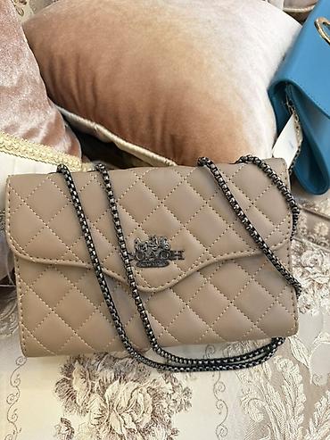 coach canta: Təsvir: - Brend: Coach (loqo ön hissədə metal emblem ilə) - Model — 1