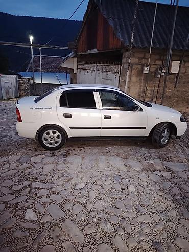 195 50 15: Opel Astra: 1.6 l | 2000 il 111222 km Sedan — 4