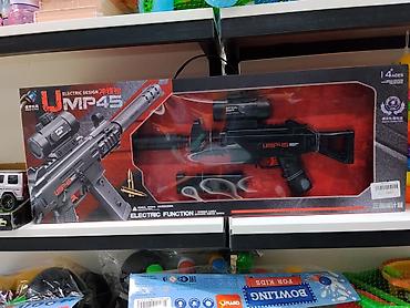 Игрушечный автомат UMP45 с электрической функцией. Выполнен в