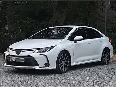 byd e6: Toyota Corolla: 2019 г., 1.8 л, Вариатор, Гибрид, Седан — 4
