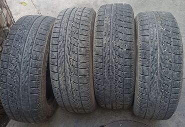 держатель для сотки: Комплект из 4 зимних шин (липучки). 195/65 R15 производство Китай. в