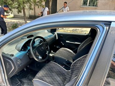купить запчасти на опель вектра б: Хэтчбек Chevrolet Aveo в голубом цвете с пятидверным кузовом. Салон