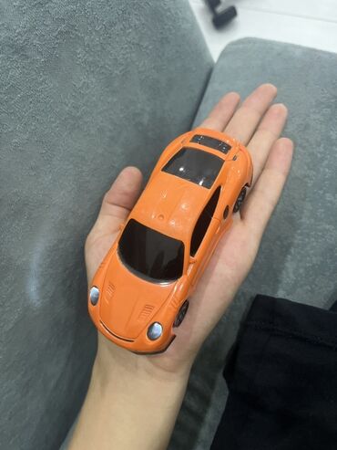 бакуган игрушки купить: Игрушечная машинка в виде оранжевого спортивного автомобиля, который