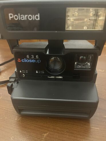 retro fotoaparati: 90 ilin polaroid fotoaparati.demek olarki yenidi.orijinaldi.ilk cixan