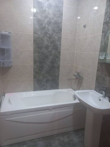 Uzunmüddətli kirayə mənzillər: Səbail rayonu, 20-ci sahədə Socarin binasında 18 mərtəbəli binanın — 9