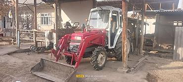 Тракторы ДТ-75: Трактор с фронтальным погрузчиком и навесным оборудованием Описание — 3