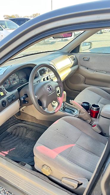футляр для кия: Mazda Capella: 2001 г., 2 л, Автомат, Бензин, Седан — 9
