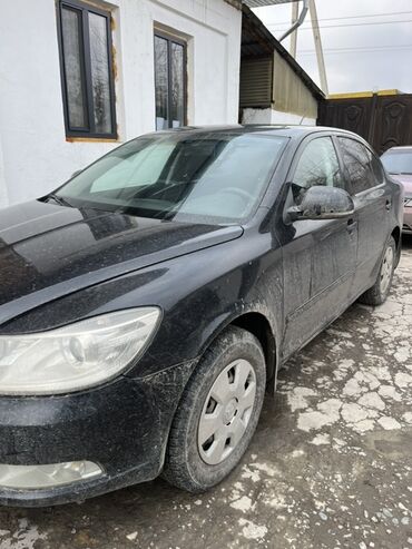 06 шоха: Черный хэтчбек Skoda Octavia с номерным знаком P267OX 190 RUS